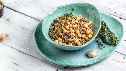 Healthy vegetable lunch from the Buddha bowl with quinoa, chickpeas and thyme. Super food, top view