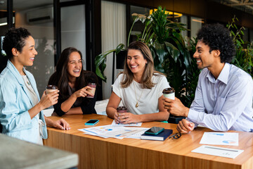 business colleagues talking causally at desk. .