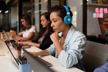 black business woman watching meeting on laptopat desk. .