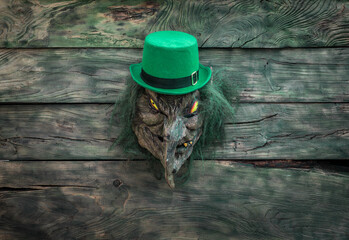 Saint patrick's day, angry leprechaun mask on wooden table