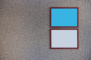 Fototapeta premium Two brown wooden frame mockup in landscape orientation on the textured wall