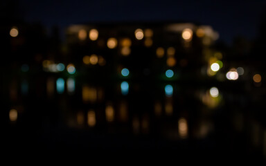 Fototapeta na wymiar Soft Focus Reflection of Building Lights on a Lake