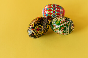 Colorful Easter eggs ona yellow background