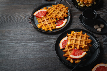 Waffle breakfast with grapefruit and coffee. Copy space.