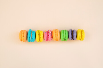 Tasty macarons on color background