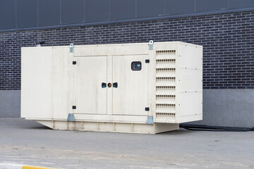 Fototapeta na wymiar Diesel generator for emergency electric power near the building.