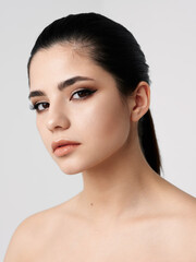 brunette face makeup naked shoulders clear skin model