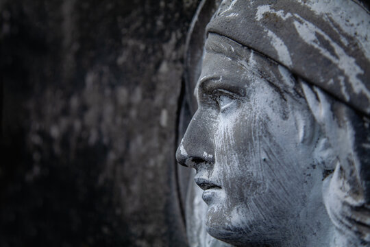 Virgin Mary. Fragment of ancient statue. Religion, faith, Christianity concept. Horizontal image.