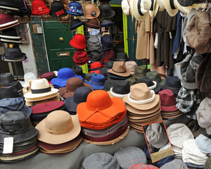 Felt hats and caps on sale at a London flea market, UK