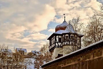 Faustturm (Faust Tower) Maulbronn named for Doctor Faustus. Onion dome on the top of a half timbered building during golden hour. Maulbronn is a city in the district of Enz in Baden-Wurttemberg.