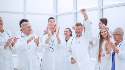 Fototapeta na wymiar group of medical colleagues applauding their overall success.