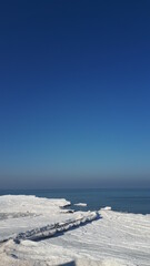Fototapeta na wymiar Winter on the Curonian Spit. Frozen Baltic Sea