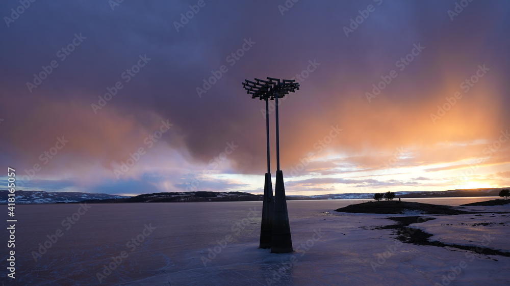 Wall mural sunset at hamar mjosa lake