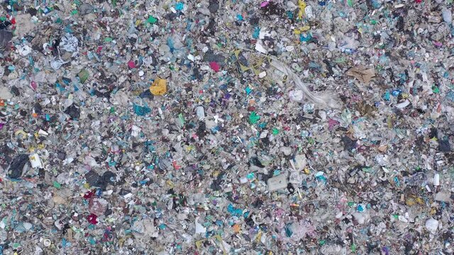 Aerial top drone view of large garbage pile, trash dump, landfill, waste from household dumping site, garbage background. Consumerism and contamination concept