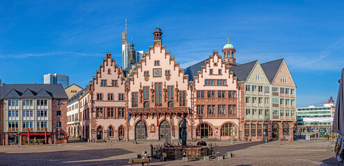 Panoramic view over historic Frankfurt Römer square with city hall, cobblestone streets and old half-timbered houses in morning light