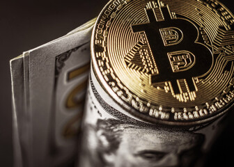 Bitcoin on paper usd banknote, close-up. Money of the future, cryptocurrency concept