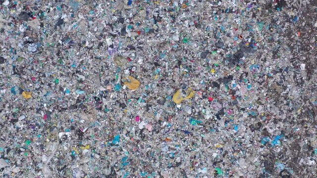Aerial top drone view of large garbage pile, trash dump, landfill, waste from household dumping site, garbage background. Consumerism and contamination concept