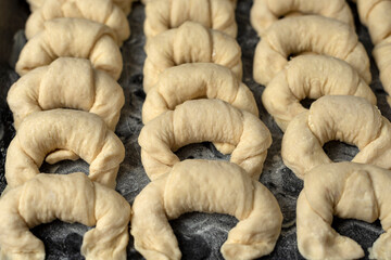 raw croissants in a metal tray ready to bake