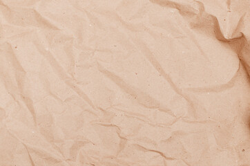 textural background. Rumpled brown cardboard paper texture