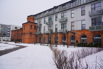 Architecture in Lodz. Housing estate and hotel . Mix of old and modern architecture. Winter day 