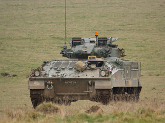 Fototapeta premium british army FV510 warrior light infantry fighting vehicle tank on maneuvers on Salisbury Plain, Wiltshire