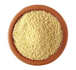 Peeled yellow millet seeds, organic food product in clay pot isolated on white background, top view