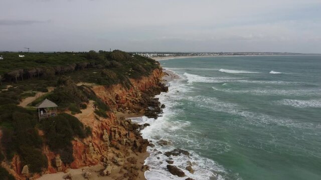 Aerial view of a beach with cliffs
