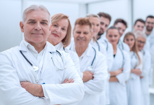 large group of medical colleagues standing in a row.