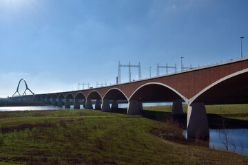 Beautiful bridge with graceful arches spanning the river Waal near Nijmegen, Netherlands