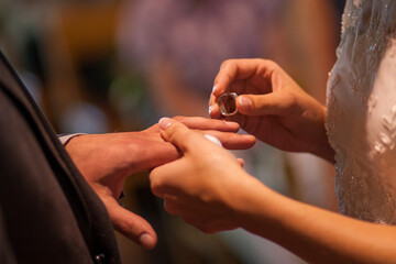 Obraz na płótnie Canvas the bride and groom exchange rings. High quality photo
