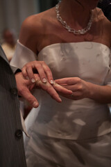 the bride and groom exchange rings. High quality photo