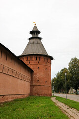 Fototapeta na wymiar red brick wall and tower of Saviour Monastery of St. Euthymius in Suzdal, Russia