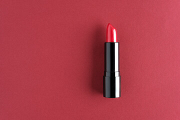 Red lipstick isolated on a cherry background.