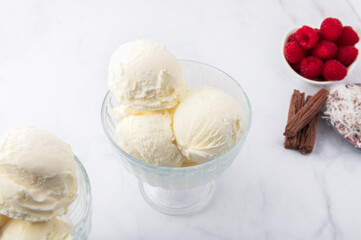 Vanilla Ice Cream Scoops with raspberries and chocolate sticks, easy dessert at home