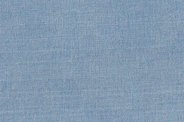 Blue Denim Fabric textured background or wallpaper from rough Denim fabric of blue lime color and a blank space.