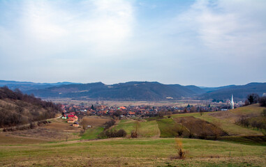 landscape with a village between the hills