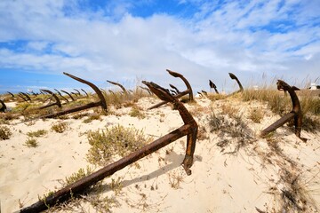 Anchor Cemetery of Santa Luzia - Portugal. Broken anchors along the sand dunes of Praia do Barril beach
