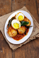 Telur bumbu Bali is Indonesian traditional food from Bali made from boiled egg with spicy sauce.