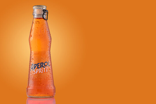 Bottle Of Aperol Spritz Summer Cocktail Drink On Orange Background.