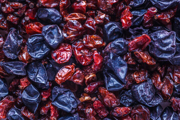 dried barberry berries. A mixture of different spices close up. Textures of colorful spices and...