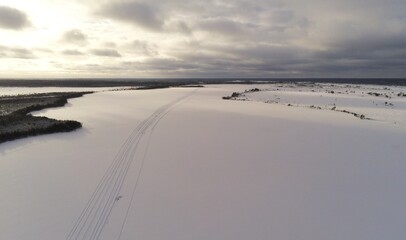 Winter drone view over snow covered bog area in Estonia