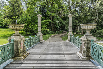 Gorgeous ancient Bridge in English Garden (Jardin Anglais, 1817). Famous Chateau de Chantilly (Chantilly Castle, 1560) - historic chateau, town of Chantilly, Oise, Picardie, France.