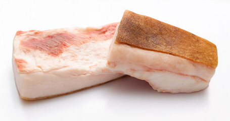 raw lard two pieces on white background, pork fat