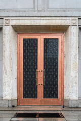 Old wooden door with shutters