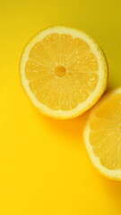 Fototapeta na wymiar Half of the cut lemon isolated on yellow