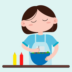 A young woman with short dark hair in a blue T-shirt and a chef's apron. Woman preparing salad in the kitchen.