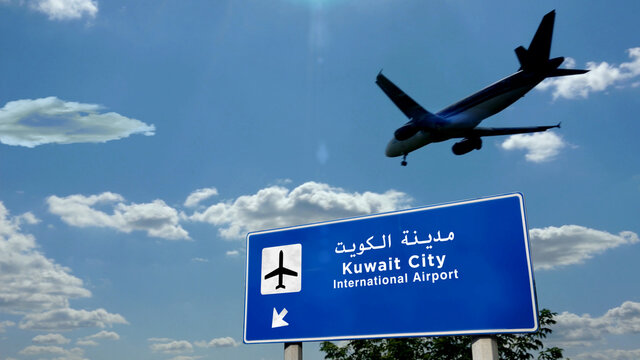 Plane landing in Kuwait City airport with signboard