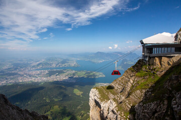 Naklejka premium a gondola descends from the mountains