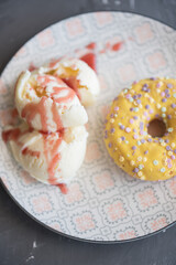 donuts yellow and chocolate Grey background