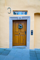 a crooked wooden door in an old European town